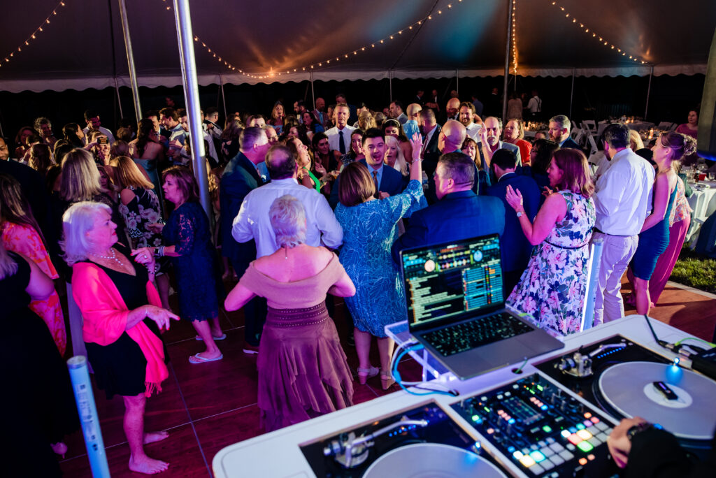 DJ and crowded dance floor.